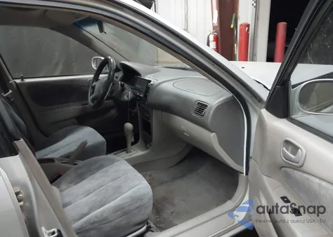 1999 Toyota Corolla Le from USA, damaged, VIN 2T1BR12E6XC172966